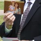 Scott showing picture to add to vault
